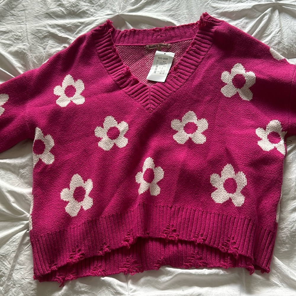 pink cropped sweater! Fringed at bottom and never worn. Still has tag!